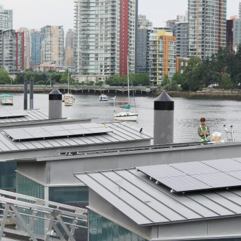 Duncan Martin of Vancouver Renewable Energy installing Creekside solar panels for Solar Now.