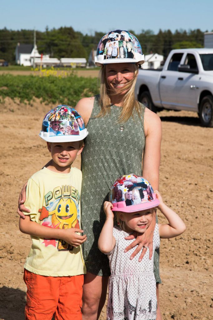 Angela Nooren with son Luke and daughter Aleida at the Project Hope construction site.
